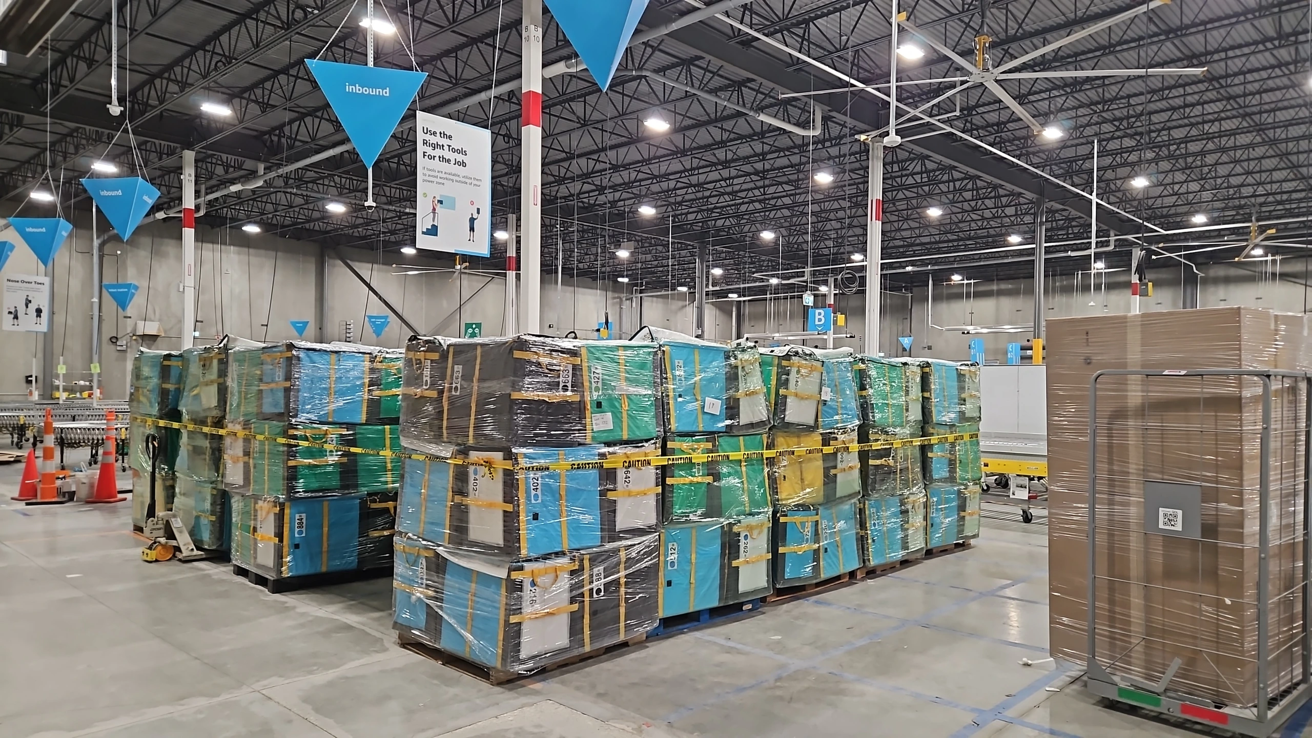 Dismantled equipment wrapped and stacked on pallets, ready to leave the site